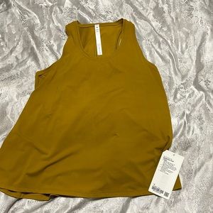 Lululemon essential tank sz 12 in gold spice